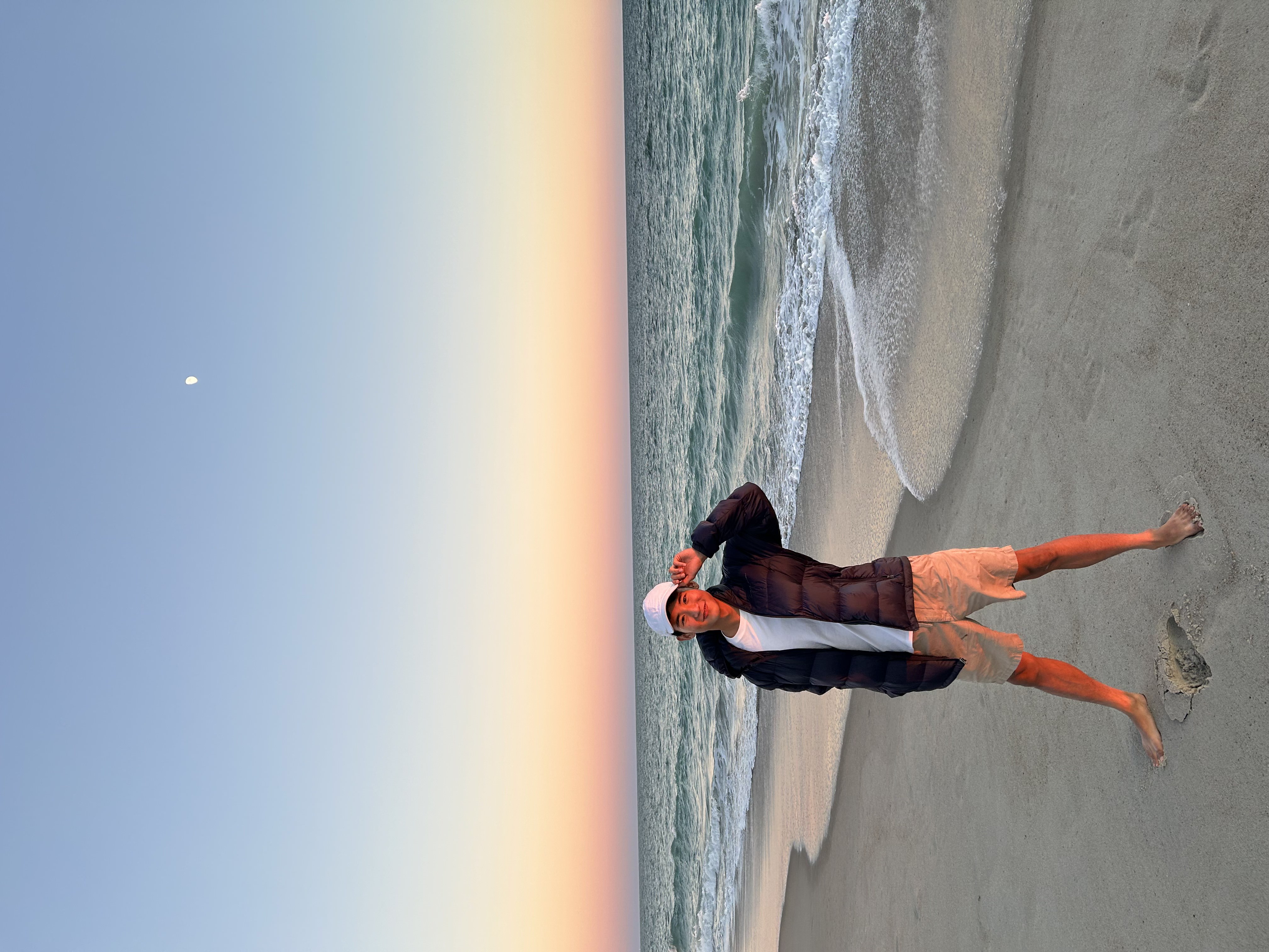 Ryan Yung on the beach at sunset